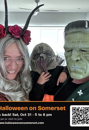 A family dressed as monsters, with event details & QR code